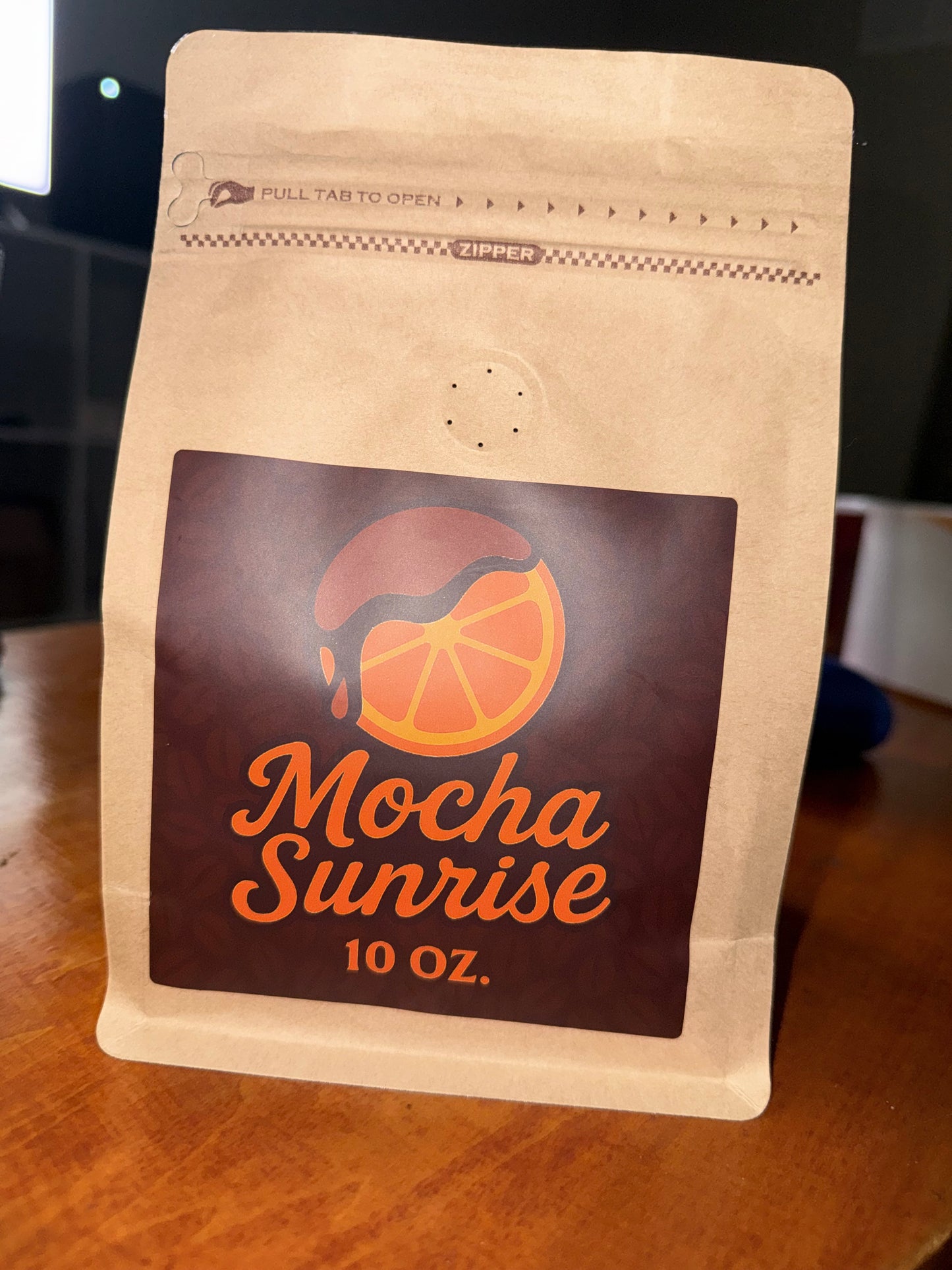 Mocha Sunrise coffee package on a wooden surface